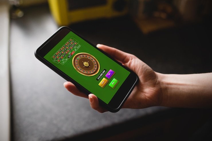 Filipino player accessing 555jili Casino on a mobile device showing live dealer game options
